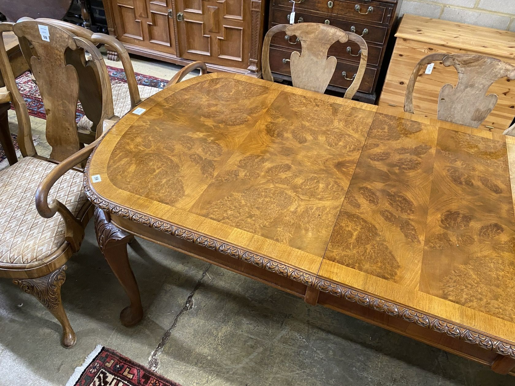 A Queen Anne revival burr walnut extending dining table, approx. 250cm extended, two spare leaves, width 90cm, height 77cm